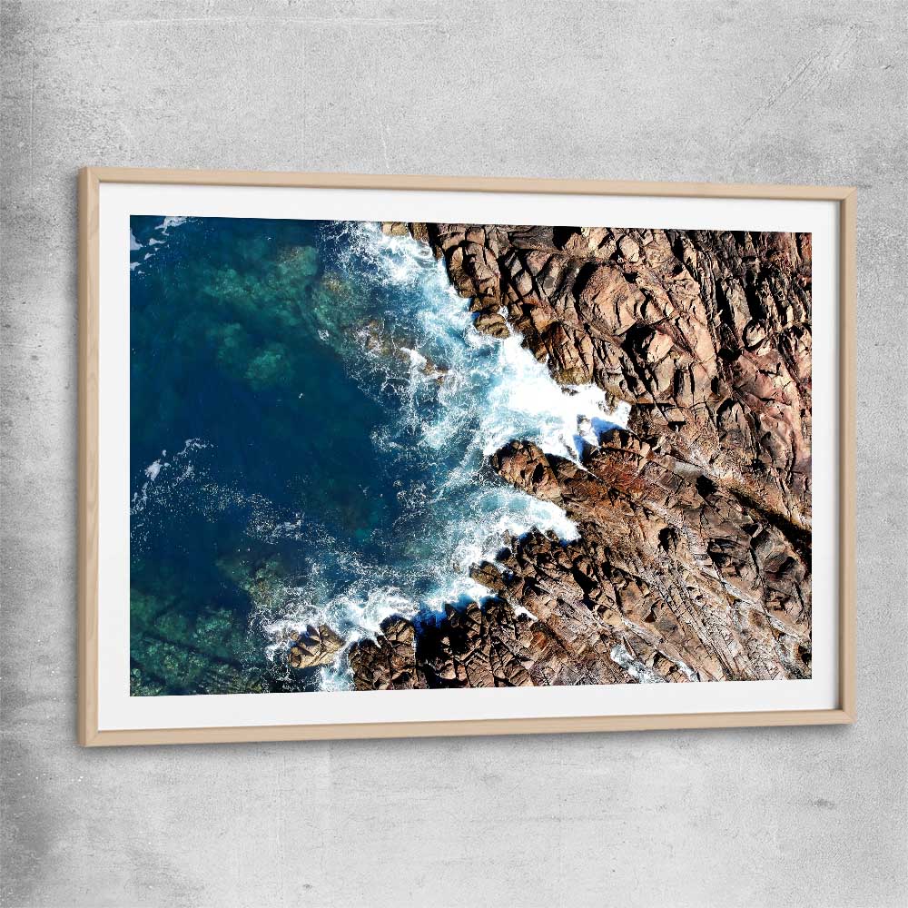 Beach and coastal wall art print of Canal Rocks One with raw oak glass front frame