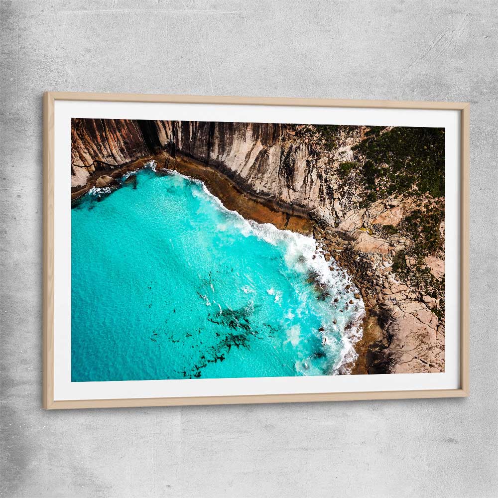 Beach and coastal wall art print of Crystal Clear Tides with raw oak glass front frame