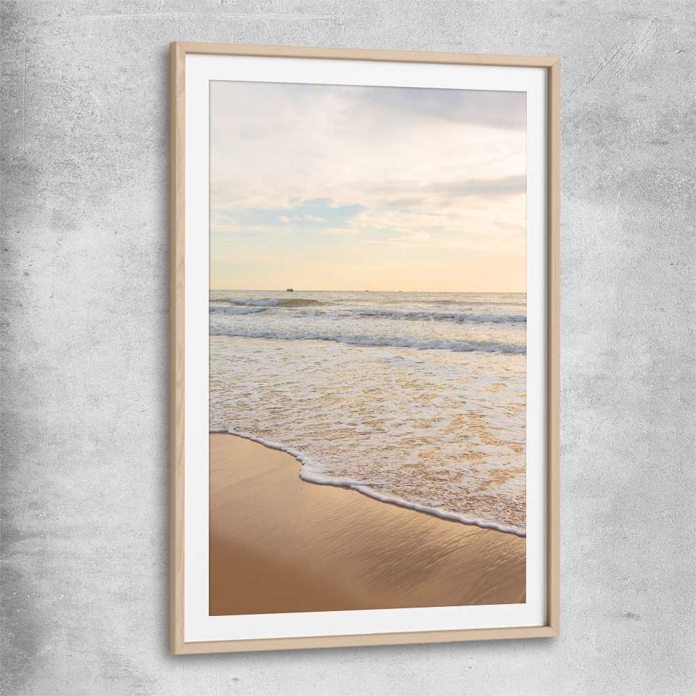 Beach and coastal wall art print of Gentle Tide with raw oak glass front frame