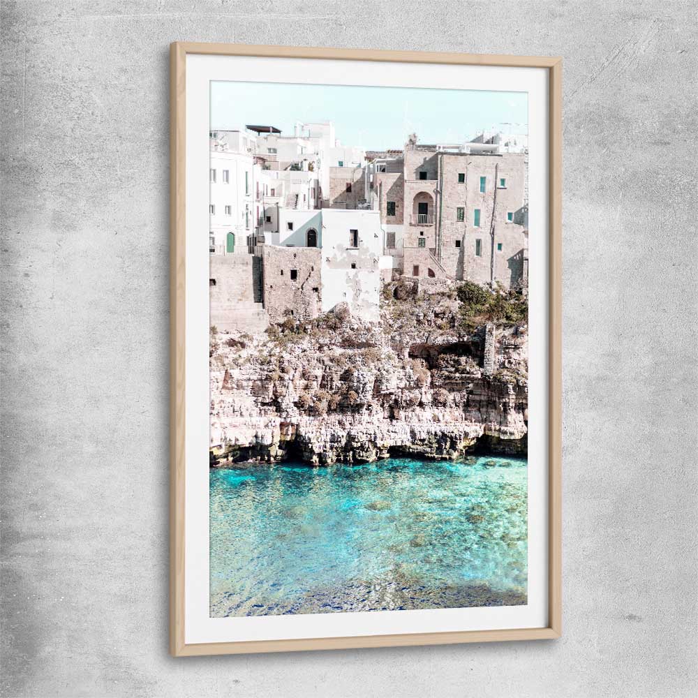 Beach and coastal wall art print of Polignano a Mare with raw oak glass front frame