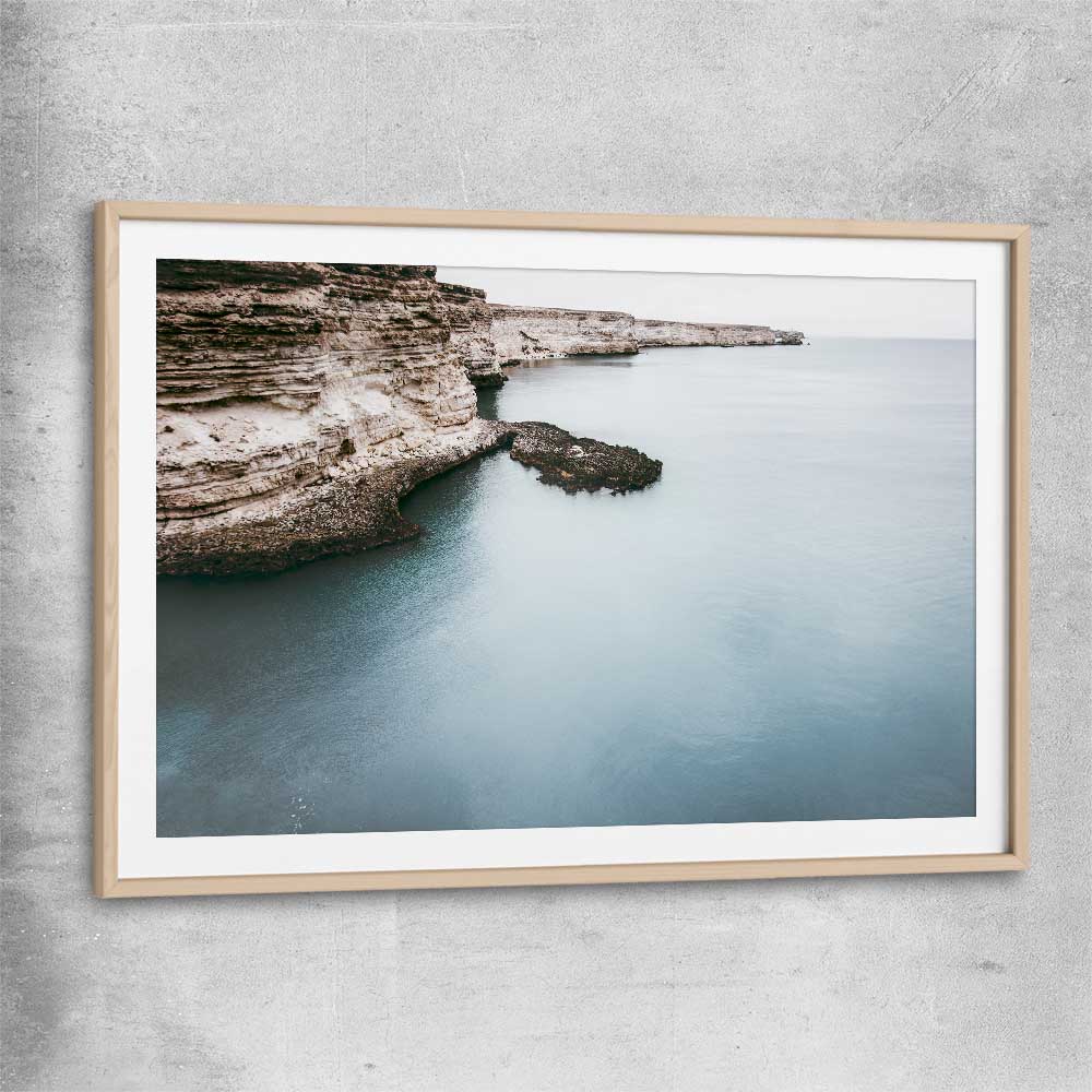 Beach and coastal wall art print of Quiet Waters with raw oak glass front frame