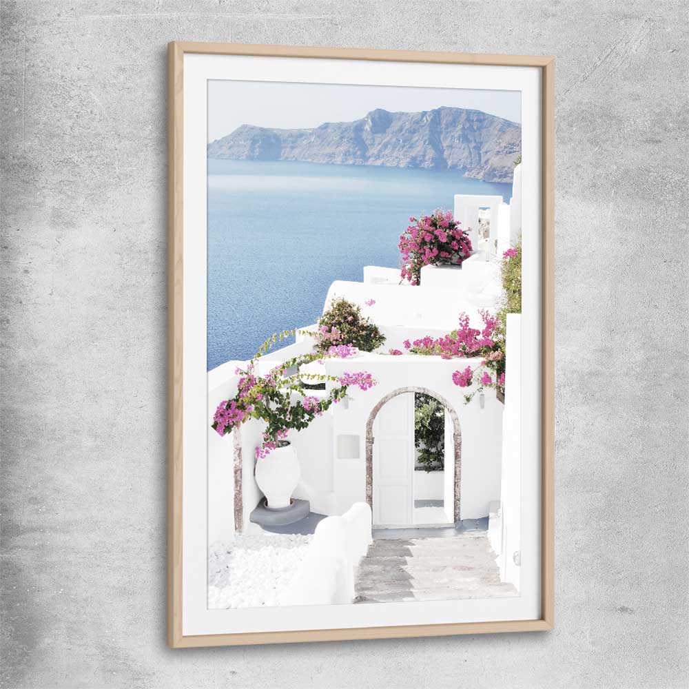 Beach and coastal wall art print of Santorini Island with raw oak glass front frame