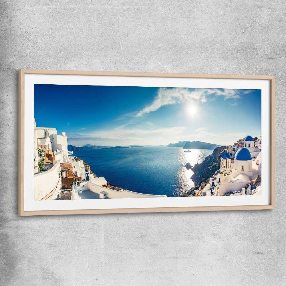 Beach and coastal wall art print of Santorini Panorama with raw oak glass front frame
