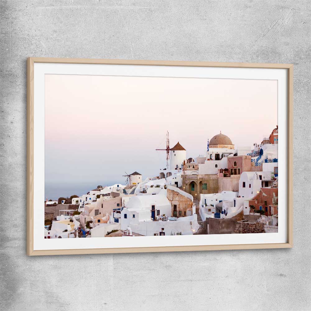Beach and coastal wall art print of Santorini Sunrise with raw oak glass front frame