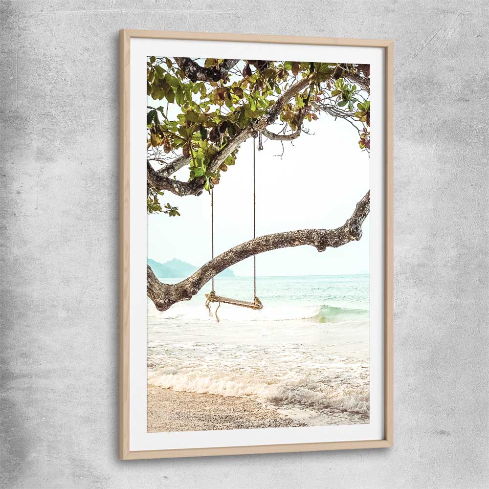 Beach and coastal wall art print of Tropical Swing with raw oak glass front frame