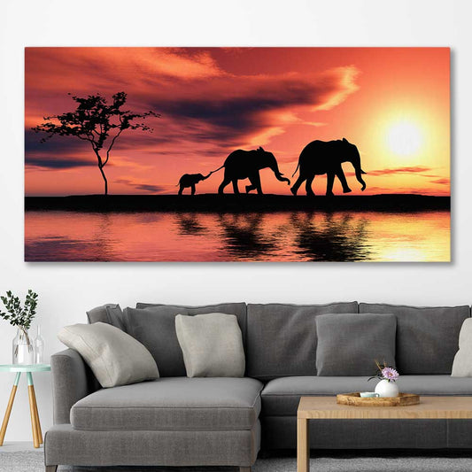Animal wall art and canvas prints of Elephant Family Dawn on a stretched canvas displayed in a room