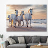 Animal wall art and canvas prints of Ocean Breeze Horses on a stretched canvas displayed in a room