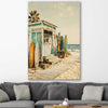 Beach and coastal wall art print of Seaside Surf Shack on a stretched canvas displayed in a room
