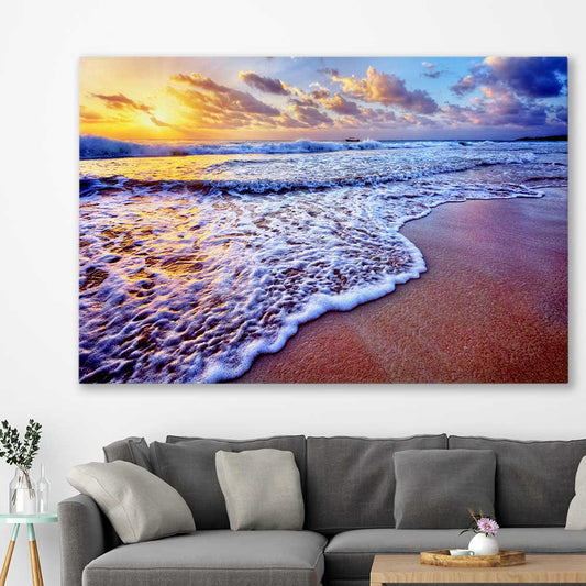 Beach and coastal wall art print of Sunset Coastal Glow on a stretched canvas displayed in a room
