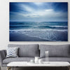 Beach and coastal wall art print of Beach Solitude on a stretched canvas displayed in a room
