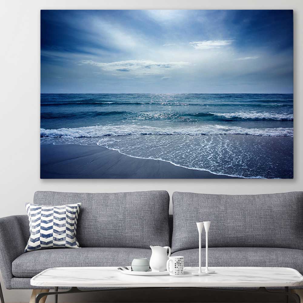 Beach and coastal wall art print of Beach Solitude on a stretched canvas displayed in a room