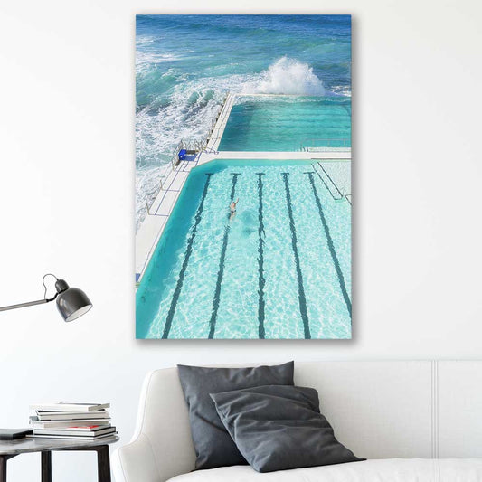 Beach and coastal wall art print of Bondi Iceberg on a stretched canvas displayed in a room