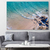 Beach and coastal wall art print of Byron Bay Rocks on a stretched canvas displayed in a room