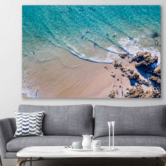Beach and coastal wall art print of Byron Bay Rocks on a stretched canvas displayed in a room