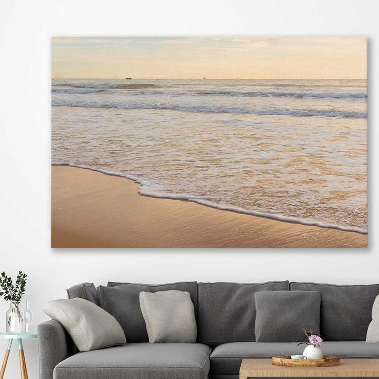 Beach and coastal wall art print of Calm Tides on a stretched canvas displayed in a room