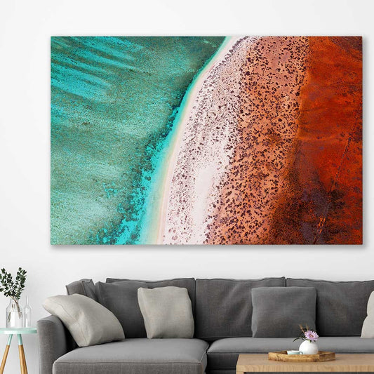 Beach and coastal wall art print of Cape Range Aerial on a stretched canvas displayed in a room