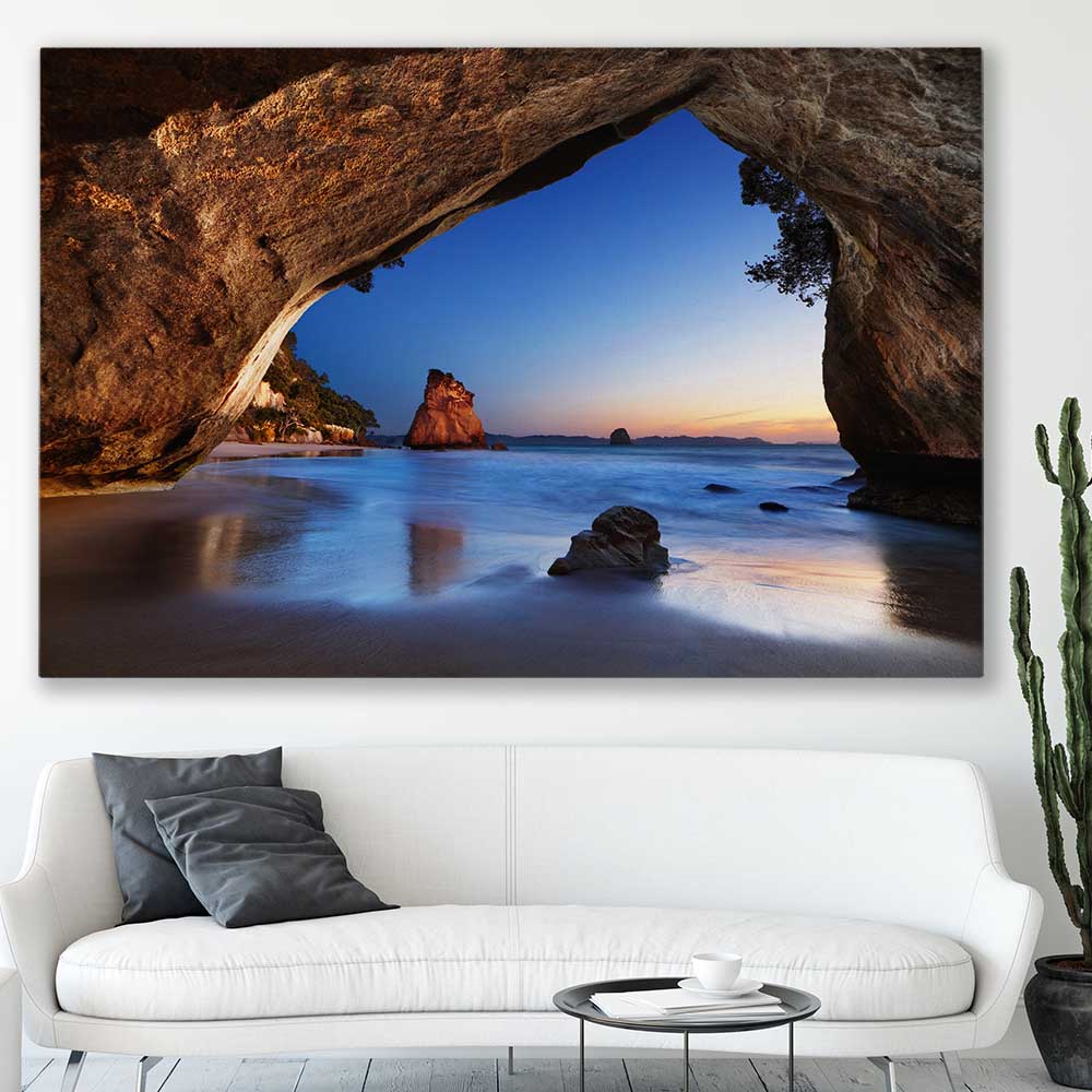 Beach and coastal wall art print of Cathedral Cove New Zealand on a stretched canvas displayed in a room