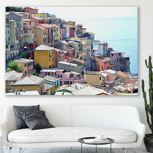 Beach and coastal wall art print of Cinque Terre on a stretched canvas displayed in a room