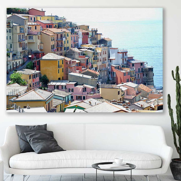 Beach and coastal wall art print of Cinque Terre on a stretched canvas displayed in a room