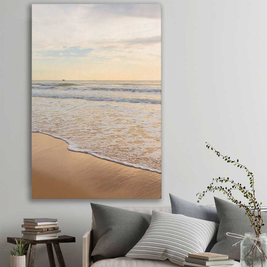 Beach and coastal wall art print of Gentle Tide on a stretched canvas displayed in a room