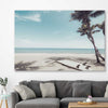 Beach and coastal wall art print of Palm Tropics on a stretched canvas displayed in a room