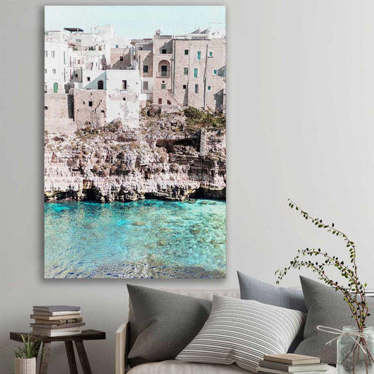 Beach and coastal wall art print of Polignano a Mare on a stretched canvas displayed in a room