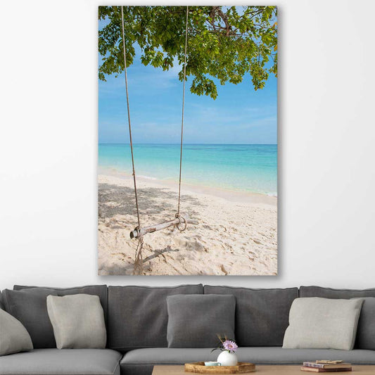 Beach and coastal wall art print of Pristine Beach Swing on a stretched canvas displayed in a room