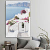 Beach and coastal wall art print of Santorini Island on a stretched canvas displayed in a room