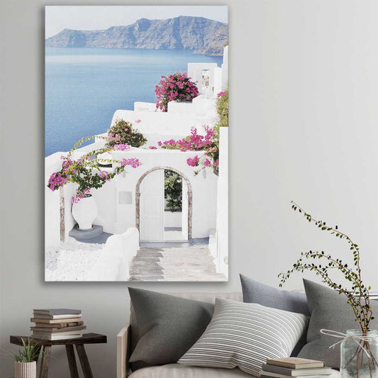 Beach and coastal wall art print of Santorini Island on a stretched canvas displayed in a room