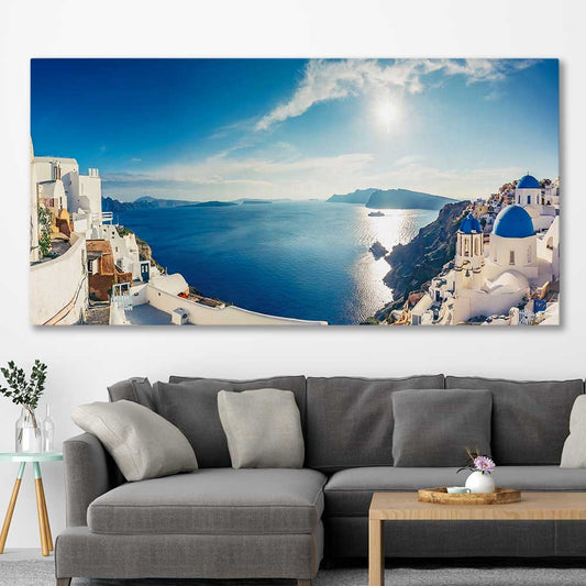 Beach and coastal wall art print of Santorini Panorama on a stretched canvas displayed in a room