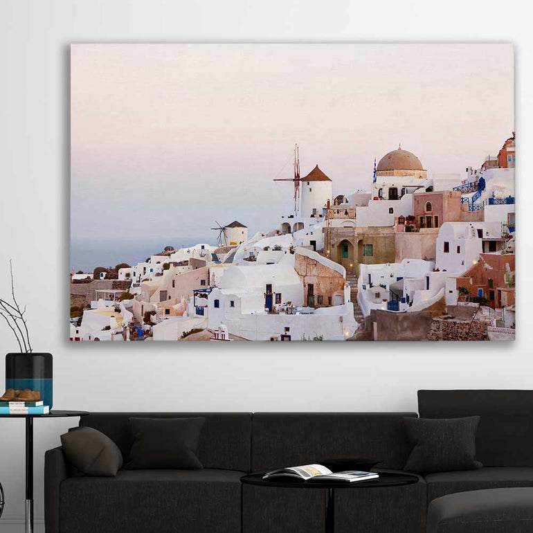 Beach and coastal wall art print of Santorini Sunrise on a stretched canvas displayed in a room