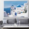 Beach and coastal wall art print of Santorini Views on a stretched canvas displayed in a room
