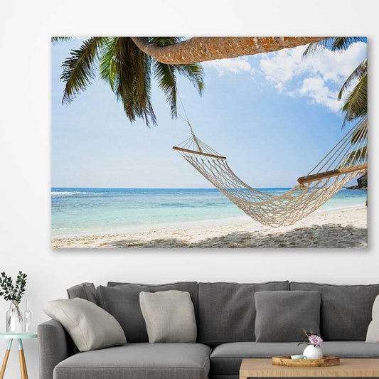 Beach and coastal wall art print of Seychelles Hammock on a stretched canvas displayed in a room