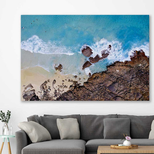 Beach and coastal wall art print of Smiths Beach on a stretched canvas displayed in a room