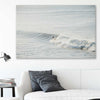 Beach and coastal wall art print of Surfing Waves on a stretched canvas displayed in a room