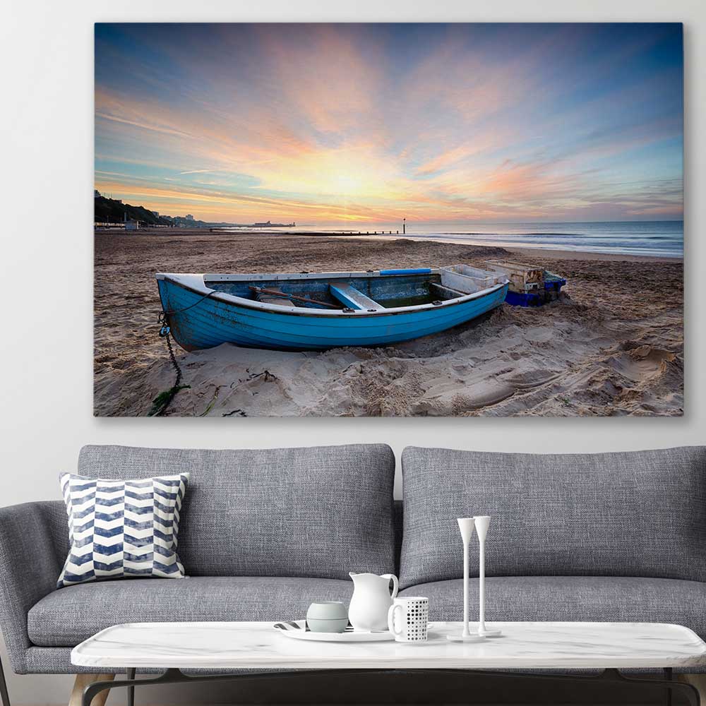 Beach and coastal wall art print of Vintage Fishing Boat on a stretched canvas displayed in a room