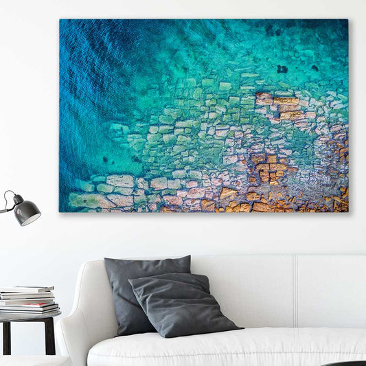 Beach and coastal wall art print of Watsons Bay Rocks on a stretched canvas displayed in a room