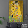Classic wall art and canvas print of The Kiss Gustav Klimt on a stretched canvas displayed in a room