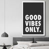 Inspirational wall art print of Good Vibes Only on a stretched canvas displayed in a room