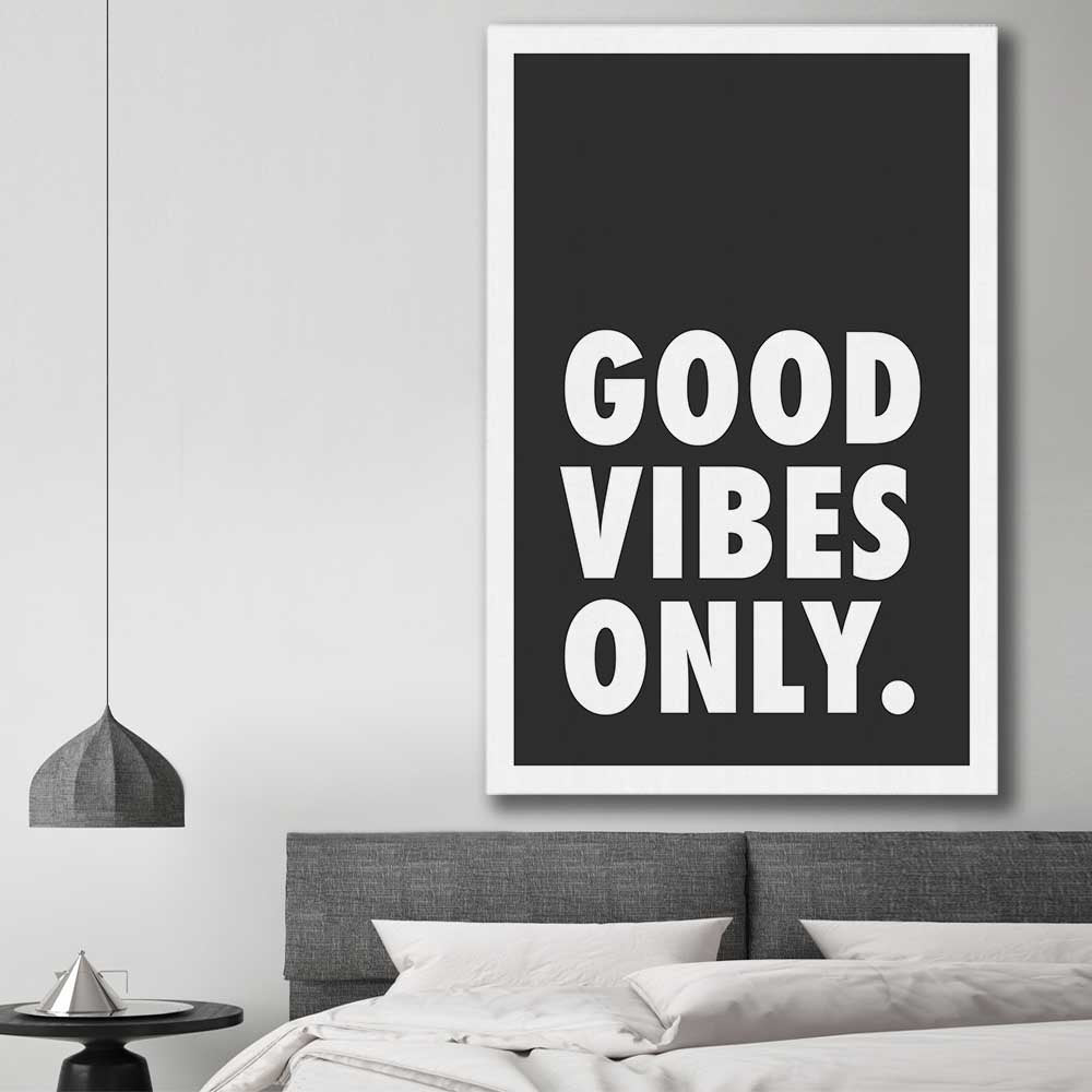 Inspirational wall art print of Good Vibes Only on a stretched canvas displayed in a room
