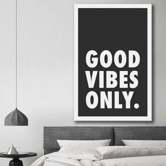 Inspirational wall art print of Good Vibes Only on a stretched canvas displayed in a room