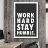 Inspirational wall art print of Work Hard on a stretched canvas displayed in a room