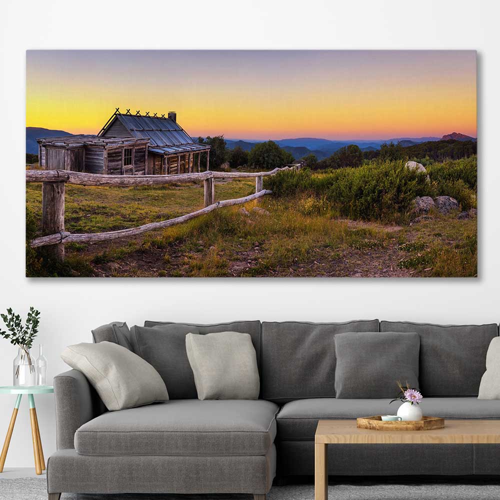 Floral print of Craigs Hut at Sunset on a stretched canvas displayed in a room