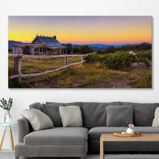 Floral print of Craigs Hut at Sunset on a stretched canvas displayed in a room