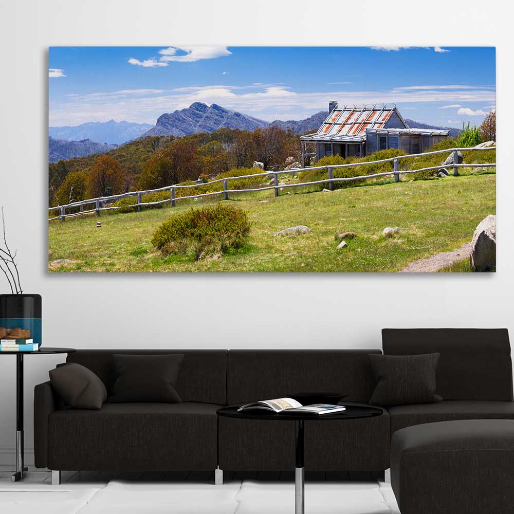 Floral print of Victorian Alps Craigs Hut on a stretched canvas displayed in a room