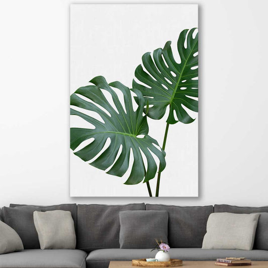 Floral print of Monstera Leaf One on a stretched canvas displayed in a room