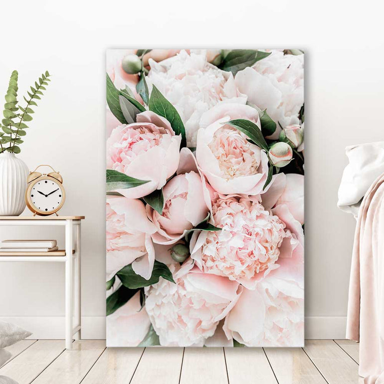 Floral print of Pink Peonies on a stretched canvas displayed in a room