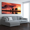 Animal wall art and canvas prints of Elephant Family Dawn on a stretched canvas displayed from an angle in a room