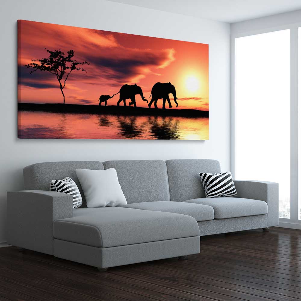 Animal wall art and canvas prints of Elephant Family Dawn on a stretched canvas displayed from an angle in a room