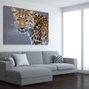 Animal wall art and canvas prints of Leopard Silent Watch on a stretched canvas displayed from an angle in a room